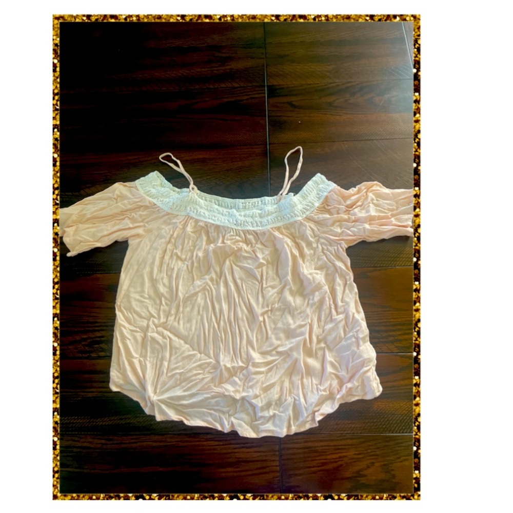 Low shoulder blouse. Light pink with a nice lace design.